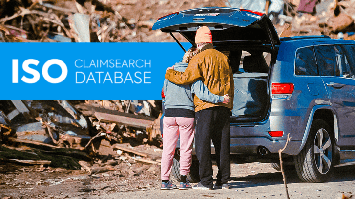 ISO Claimsearch Database (Image of two people hugging each other at what looks like an aftermath of a a disaster)