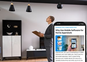Real Estate Agent Evaluating a property looking at the ceiling lamps with a phone with an article on why use mobile Software for home appraisals