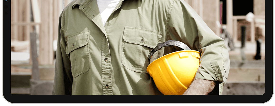 lower fram ipad with contractor holding yellow helmet